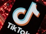 Australia TikTok Ban: A smartphone with a displayed TikTok logo is placed on a computer motherboard in this illustration.