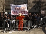Demonstrators gather outside New York criminal court, Tuesday in New York. Demonstrators gather outside New York criminal court, Tuesday in New York.