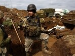 Ukrainian service men Oleksandr and Oleksandr of the 24th brigade stand guard at their position in the trenches at the frontline, amid Russia?s attack on Ukraine, near Niu York, Donetsk region, Ukraine, April 4. 