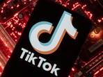 A smartphone with a displayed TikTok logo is placed on a computer motherboard in this illustration taken February 23, 2023. REUTERS/Dado Ruvic/Illustration
