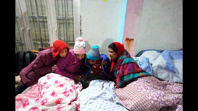 A displaced family watches their mobile phone in a temporary accommodation in a hotel, in Joshimath, Uttarakhand (AP) A displaced family watches their mobile phone in a temporary accommodation in a hotel, in Joshimath, Uttarakhand (AP)