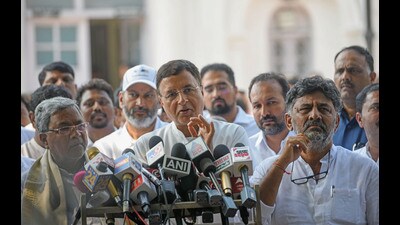 Congress leader Randeep Singh Surjewala, along with party leaders DK Shivakumar and Siddaramaiah, after the Congress Central Election Committee meeting regarding the upcoming Karnataka assembly elections, in New Delhi on Tuesday. (ANI) Congress leader Randeep Singh Surjewala, along with party leaders DK Shivakumar and Siddaramaiah, after the Congress Central Election Committee meeting regarding the upcoming Karnataka assembly elections, in New Delhi on Tuesday. (ANI)