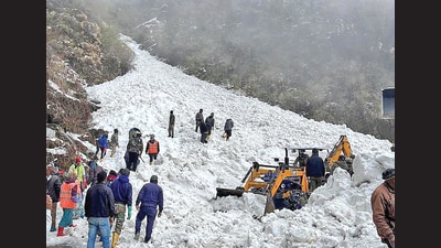Rescue team members search for survivors after an avalanche in Sikkim on Tuesday. (REUTERS) Rescue team members search for survivors after an avalanche in Sikkim on Tuesday. (REUTERS)