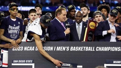 Alex Karaban #11 of the Connecticut Huskies places the UConn name in the national champion spot after defeating the San Diego State Aztecs 76-59 during the NCAA Men's Basketball Tournament National Championship game at NRG Stadium on April 03, 2023 in Houston, Texas. (Getty Images via AFP) Alex Karaban #11 of the Connecticut Huskies places the UConn name in the national champion spot after defeating the San Diego State Aztecs 76-59 during the NCAA Men's Basketball Tournament National Championship game at NRG Stadium on April 03, 2023 in Houston, Texas. (Getty Images via AFP)