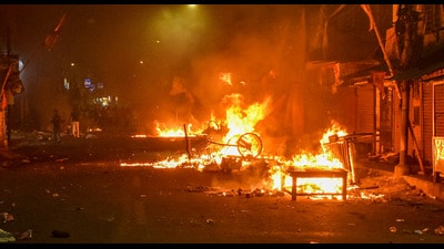 Vehicles set on fire by miscreants during clashes between two groups, at Kajipara in Howrah district on March 30. (PTI) Vehicles set on fire by miscreants during clashes between two groups, at Kajipara in Howrah district on March 30. (PTI)