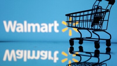 Shopping trolley is seen in front of Walmart logo. (REUTERS)