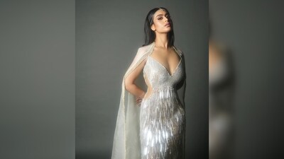 Nysa, on the other hand, wore a plunging neckline gown with feather detailing and a sheer cape from the same label. (Instagram/@kajol) Nysa, on the other hand, wore a plunging neckline gown with feather detailing and a sheer cape from the same label. (Instagram/@kajol)