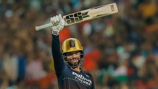 Rajat Patidar of Royal Challengers Bangalore raises his bat after scoring a century (PTI)