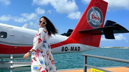 Neha Dhupia also talks about body positivity on social media. She is seen here posing in front of a water plane upon reaching Maldives.&nbsp;