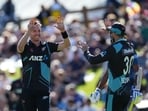 New Zealand's Adam Milne (L) celebrates with teammates after taking a wicket during the second Twenty20 international cricket match between New Zealand and Sri Lanka in Dunedin on April 5, 2023. (Photo by Sameera PEIRIS / AFP)
