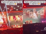 Taylor Swift gifts signed hat to fan mid-concert. Taylor Swift gifts signed hat to fan mid-concert.