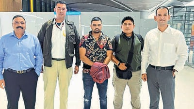 Authorities with gangster Deepak Boxer (centre) in New Delhi on Wednesday. (HT PHOTO) Authorities with gangster Deepak Boxer (centre) in New Delhi on Wednesday. (HT PHOTO)