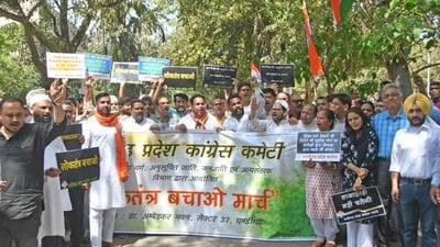 Congress members holding up placards during the party’s ‘Save Constitution’ march in Chandigarh. (Ravi Kumar/HT)