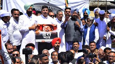 Leader of opposition Partap Singh Bajwa and state Congress president Amarinder Singh Raja Warring along with party workers during the protest in Ludhiana on Wednesday. (Gurpreet Singh/HT Photo) Leader of opposition Partap Singh Bajwa and state Congress president Amarinder Singh Raja Warring along with party workers during the protest in Ludhiana on Wednesday. (Gurpreet Singh/HT Photo)