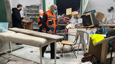Palestinian medics check the damage at the first-aid room of the Al-Aqsa mosque in Jerusalem's Old City, following clashes between Palestinian worshippers and Israeli security forces early on Wednesday. (AFP)