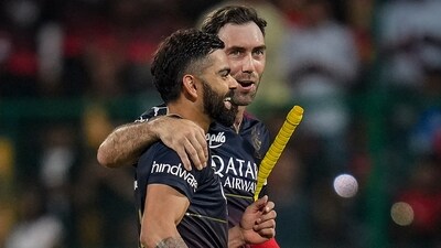 Bengaluru: Royal Challengers Bangalore batters Virat Kohli and Glenn Maxwell walk back after winning over Mumbai Indians during the IPL 2023 match between Royal Challengers Bangalore and Mumbai Indians at M Chinnaswamy Stadium, in Bengaluru, Sunday, April 2, 2023. (PTI Photo/Shailendra Bhojak)(PTI04_02_2023_000418A) (PTI) Bengaluru: Royal Challengers Bangalore batters Virat Kohli and Glenn Maxwell walk back after winning over Mumbai Indians during the IPL 2023 match between Royal Challengers Bangalore and Mumbai Indians at M Chinnaswamy Stadium, in Bengaluru, Sunday, April 2, 2023. (PTI Photo/Shailendra Bhojak)(PTI04_02_2023_000418A) (PTI)