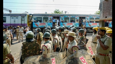 Security personnel deployed as train services resume at violence-affected Rishra area, following clashes between two groups during a Ram Navami procession, in Hooghly district. (PTI) Security personnel deployed as train services resume at violence-affected Rishra area, following clashes between two groups during a Ram Navami procession, in Hooghly district. (PTI)