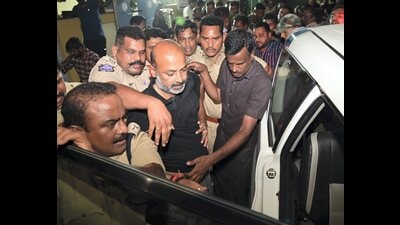 Telangana BJP president and MP Bandi Sanjay being detained by the police from his residence after midnight in Karimnagar, on Wednesday. (PTI) Telangana BJP president and MP Bandi Sanjay being detained by the police from his residence after midnight in Karimnagar, on Wednesday. (PTI)