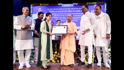 The CM presenting an appointment letter to a newly-recruited candidate in Lucknow on Wednesday (Deepak Gupta/HT) The CM presenting an appointment letter to a newly-recruited candidate in Lucknow on Wednesday (Deepak Gupta/HT)