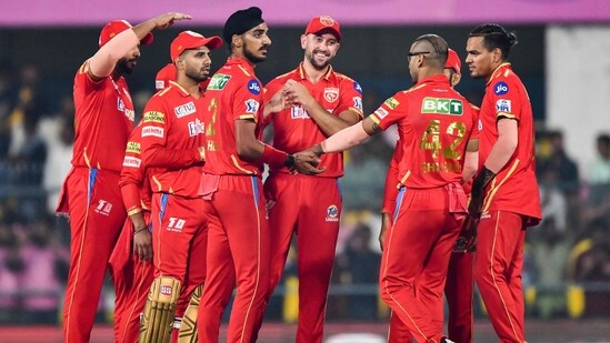 Arshdeep Singh celebrates with teammates after the dismissal of Yashasvi Jaiswal during IPL 2023(AFP)