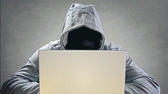 Computer hacker stealing data from a laptop concept for network security, identity theft and computer crime (HTfile)