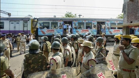 Hooghly: Security personnel deployed as train services resume at violence-affected Rishra area, following clashes between two groups during a 'Ram Navami' procession, in Hooghly district. (PTI)