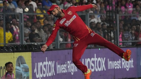 Sikandar Raza jumps take a catch on the boundary line during the Indian Premier League 2023 match between Punjab Kings and Rajasthan Royals(AP)