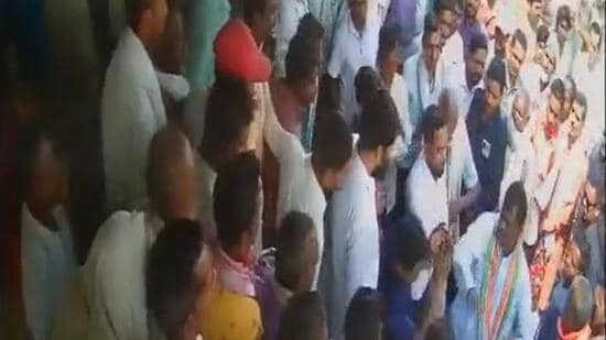 The Congress MLA (bottom right) seen slapping the cooperative bank employee. (CCTV footage/Twitter)
