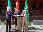 Iran's Foreign Minister Hossein Amirabdollahian, left, shakes hands with his Saudi Arabian counterpart Prince Faisal bin Farhan Al Saud, right, and Chineses counterpart Qin Gang in Beijing Thursday. (Iranian Foreign Ministry via AP/PTI)
