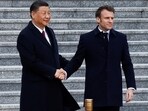 Chinese President Xi Jinping shakes hands with French President Emmanuel Macron at the Great Hall of the People, in Beijing, China, April 6, 2023.