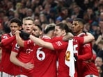 Manchester United's English striker Marcus Rashford (R) celebrates after scoring his team first goal during the English Premier League football match between Manchester United and Brentford at Old Trafford in Manchester, north west England, on April 5, 2023. (Photo by Darren Staples / AFP) / RESTRICTED TO EDITORIAL USE. No use with unauthorized audio, video, data, fixture lists, club/league logos or 'live' services. Online in-match use limited to 120 images. An additional 40 images may be used in extra time. No video emulation. Social media in-match use limited to 120 images. An additional 40 images may be used in extra time. No use in betting publications, games or single club/league/player publications. / 