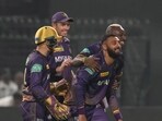 Kolkata Knight Riders' Varun Chakravarthy celebrates after taking a catch to dismiss Royal Challengers Bangalore's Akash Deep.