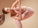 Malaika Arora practises Revolved Chair Pose in new workout picture. Malaika Arora practises Revolved Chair Pose in new workout picture.