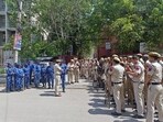 Delhi police and paramilitary personnel stand guard at Jahangirpuri area on the eve of Hanuman Jayanti, in New Delhi on Wednesday. (ANI)