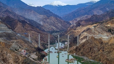 A view of pillars and buildings in the rising water of an artificial lake which gradually submerged the village of Yusufeli in Artvin province, in northeastern Turkey on April 4, 2022. The project comprises a 275m tall double curvature concrete arch dam and a power plant equipped with three 186MW vertical-axis Francis turbine units. (Yasin Akgul / AFP) A view of pillars and buildings in the rising water of an artificial lake which gradually submerged the village of Yusufeli in Artvin province, in northeastern Turkey on April 4, 2022. The project comprises a 275m tall double curvature concrete arch dam and a power plant equipped with three 186MW vertical-axis Francis turbine units. (Yasin Akgul / AFP)