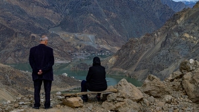 Local residents look on at their town, Yusufeli, submerged by an artificial lake caused by a dam retaining the flow of the Coruh river, Artvin province, in Turkey, on April 4. The district was relocated for the seventh time in its 153-year history, according to duvaR. English, an independent gazette of Turkey. (Yasin Akgul / AFP) Local residents look on at their town, Yusufeli, submerged by an artificial lake caused by a dam retaining the flow of the Coruh river, Artvin province, in Turkey, on April 4. The district was relocated for the seventh time in its 153-year history, according to duvaR. English, an independent gazette of Turkey. (Yasin Akgul / AFP)