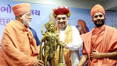 Union home minister Amit Shah being presented with an idol of Lord Hanuman during the inauguration of Shree Kashtbhanjandev Bhojnalaya at a cost of Rs.55 crores on the occasion of Hanuman Jayanti, at the Salangpur Hanuman Temple, in Botad on Thursday. (ANI via Amit Shah Twitter) Union home minister Amit Shah being presented with an idol of Lord Hanuman during the inauguration of Shree Kashtbhanjandev Bhojnalaya at a cost of Rs.55 crores on the occasion of Hanuman Jayanti, at the Salangpur Hanuman Temple, in Botad on Thursday. (ANI via Amit Shah Twitter)