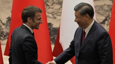 French President Emmanuel Macron, left, shakes hands with Chinese President Xi Jinping after meeting the press at the Great Hall of the People in Beijing, Thursday, April 6, 2023. (AP Photo/Ng Han Guan, Pool) (AP) French President Emmanuel Macron, left, shakes hands with Chinese President Xi Jinping after meeting the press at the Great Hall of the People in Beijing, Thursday, April 6, 2023. (AP Photo/Ng Han Guan, Pool) (AP)
