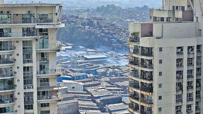 Mumbai, India - April 06, 2023: Smoke emanating from a small chimney of one of the many small scale manufacturing units in the slums amid smoggy weather in the background, at Khairani Road, Chandivali, Andheri (East), in Mumbai, India, on Thursday, April 06, 2023. (Photo by Vijay Bate/HT Photo) (HT PHOTO) Mumbai, India - April 06, 2023: Smoke emanating from a small chimney of one of the many small scale manufacturing units in the slums amid smoggy weather in the background, at Khairani Road, Chandivali, Andheri (East), in Mumbai, India, on Thursday, April 06, 2023. (Photo by Vijay Bate/HT Photo) (HT PHOTO)