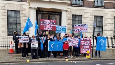 Members of Uyghur committee stage protest in London. Members of Uyghur committee stage protest in London.