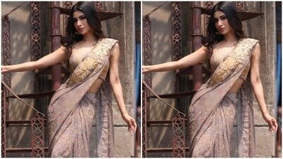 Mouni teamed her saree with a matching blouse of the same print with a plunging neckline and slip sleeves. “If I were a girl in a book, it would all be sooo easy,” Mouni captioned her pictures and called herself “a saree girl forever.” (Instagram/@imouniroy) Mouni teamed her saree with a matching blouse of the same print with a plunging neckline and slip sleeves. “If I were a girl in a book, it would all be sooo easy,” Mouni captioned her pictures and called herself “a saree girl forever.” (Instagram/@imouniroy)