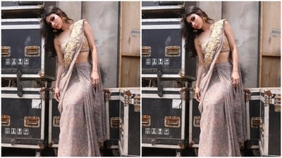 Mouni draped the grey printed georgette saree featuring embroidery patterns in shades of ochre as she posed for the outdoor photoshoot. (Instagram/@imouniroy) Mouni draped the grey printed georgette saree featuring embroidery patterns in shades of ochre as she posed for the outdoor photoshoot. (Instagram/@imouniroy)