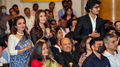 Raveena Tandon's daughter Rasha and son Ranbir Thadani clap as they witness the actor receiving the Padma Shri on Wednesday. (PTI) Raveena Tandon's daughter Rasha and son Ranbir Thadani clap as they witness the actor receiving the Padma Shri on Wednesday. (PTI)