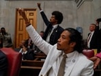 Rep. Justin Pearson and Rep. Justin Jones raise their fists as a video of last week's gun control demonstration at the statehouse is screened and Republicans who control the Tennessee House of Representatives prepare to vote on whether to expel them for their role in it, in Nashville, Tennessee, U.S., April 6, 2023.