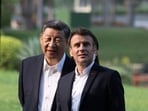 Chinese President Xi Jinping and French President Emmanuel Macron walk in the garden of the Guandong province governor's residence, in Guangzhou, China, Friday. Chinese President Xi Jinping and French President Emmanuel Macron walk in the garden of the Guandong province governor's residence, in Guangzhou, China, Friday.