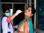 A health worker collects a swab sample for Covid-19 test at the District Hospital in Sector 30, in Noida, on Thursday. A health worker collects a swab sample for Covid-19 test at the District Hospital in Sector 30, in Noida, on Thursday.