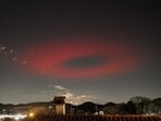 A view of the massive red light disk formed in Italy's sky on March 27. A view of the massive red light disk formed in Italy's sky on March 27.