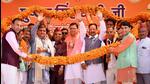 Union minister of state for defence Ajay Bhatt with Uttarakhand chief minister Pushkar Singh Dhami and others being garlanded during the inauguration and foundation stone laying of projecs in Haldwani (PTI)