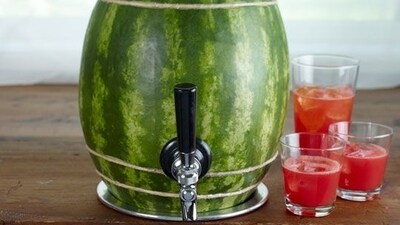 Watermelon Keg: Cut a hole in the top of a large watermelon, scoop out the fruit, and fill it with your favourite cocktail for a fun and festive party drink. This is a creative way to serve drinks at your summer parties, and it's sure to be a hit with your guests. (Pinterest) Watermelon Keg: Cut a hole in the top of a large watermelon, scoop out the fruit, and fill it with your favourite cocktail for a fun and festive party drink. This is a creative way to serve drinks at your summer parties, and it's sure to be a hit with your guests. (Pinterest)