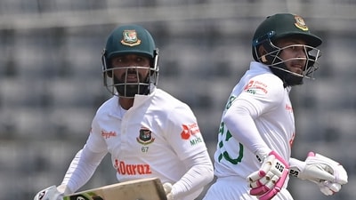 Bangladesh's Mushfiqur Rahim (R) and Mominul Haque run between the wickets during the fourth day of the Test cricket match between Bangladesh and Ireland at the Sher-e-Bangla National Cricket Stadium in Dhaka on April 7, 2023. (Photo by Munir uz ZAMAN / AFP) (AFP) Bangladesh's Mushfiqur Rahim (R) and Mominul Haque run between the wickets during the fourth day of the Test cricket match between Bangladesh and Ireland at the Sher-e-Bangla National Cricket Stadium in Dhaka on April 7, 2023. (Photo by Munir uz ZAMAN / AFP) (AFP)